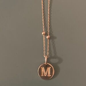 Sterling silver necklace with “m” on circle pendant